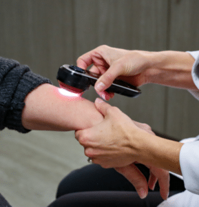 Dr. Pennie provides a skin check with a dermatoscope, aiding in skin cancer prevention